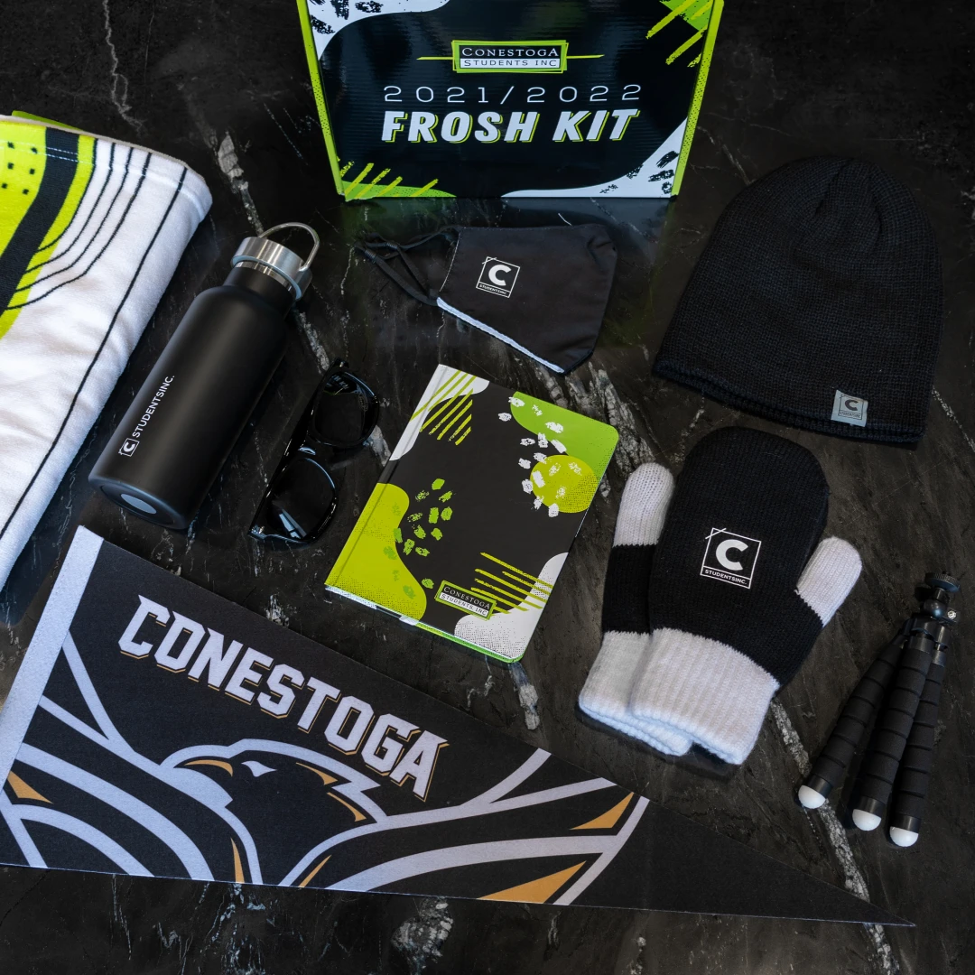 This frosh week kit provides a welcoming and exciting unboxing experience as it includes high-quality school-branded mittens, a face mask, water bottle, pennent, selfie tripod, and postcard.