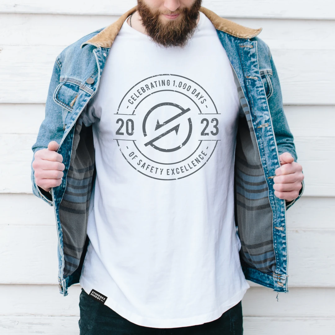 An energy, utilities and waste worker wearing a high-quality t-shirt branded with a creative design as a reward to celebrate workplace safety excellence. 