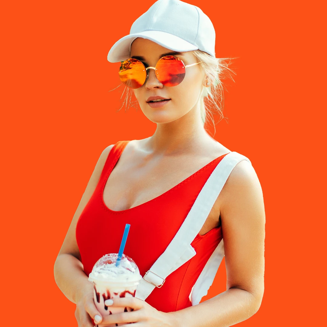 A trendy blonde woman wearing a fitted baseball cap to match her on-the-go active lifestyle.