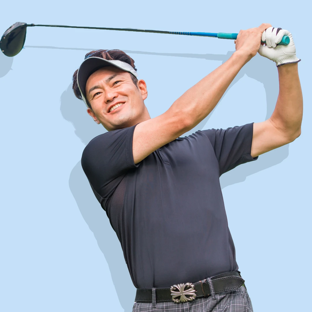 A male golfer wearing a low crown visor, suited for sunny outdoor weather.