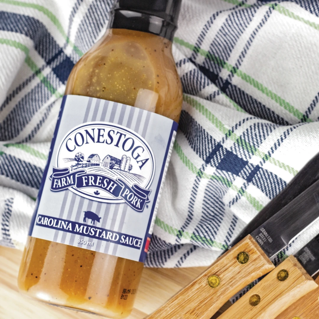 Get Sauced BBQ sauce with a creative designed custom printed label featuring the Conestoga Meats brand. A unique example of a useful and fresh promotional product giveaway solution for the food, beverage and restaurant industry.
