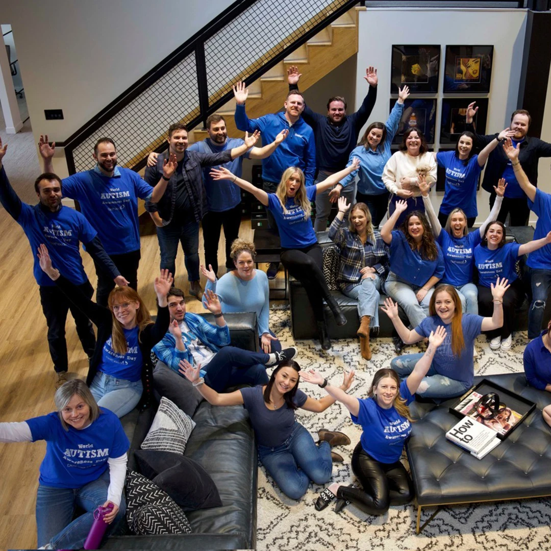 Employees proudly wearing branded t-shirts that reflect a culture of giving back, purpose, and philanthropy. Custom-branded merch items from Brand Blvd help businesses make an impact and foster a strong sense of community.