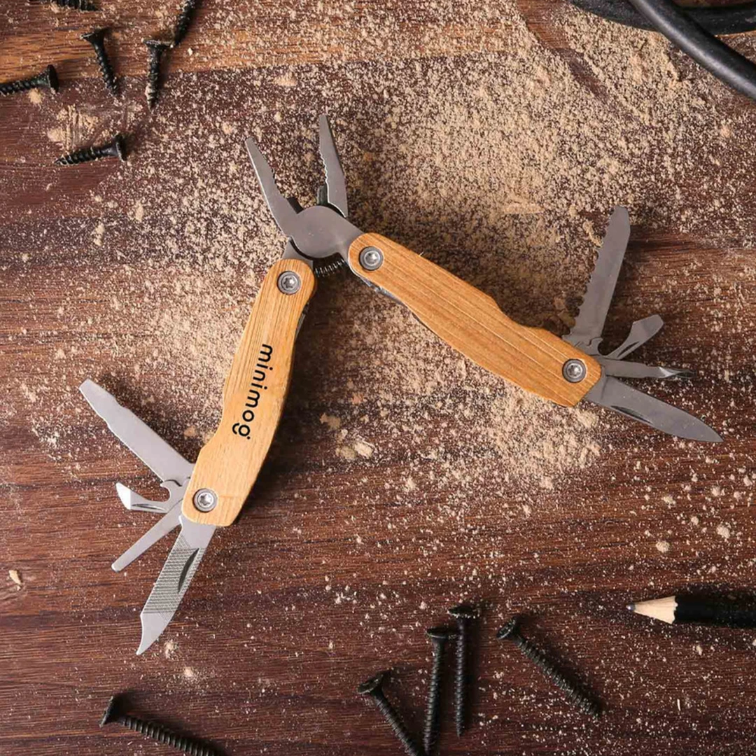 Versatile multi-tool branded with company logo on rustic wood background. Must-have swag for successful manufacturing, industrial, and warehouse companies. Tools and equipment make high-quality and practical branded merch perfect for day-to-day tasks.