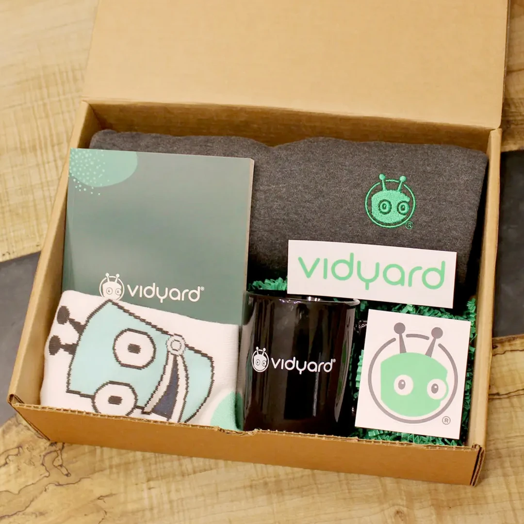 Onboarding swag kit full of company-branded merchandise products is packaged in a box and ready for dropshipping.