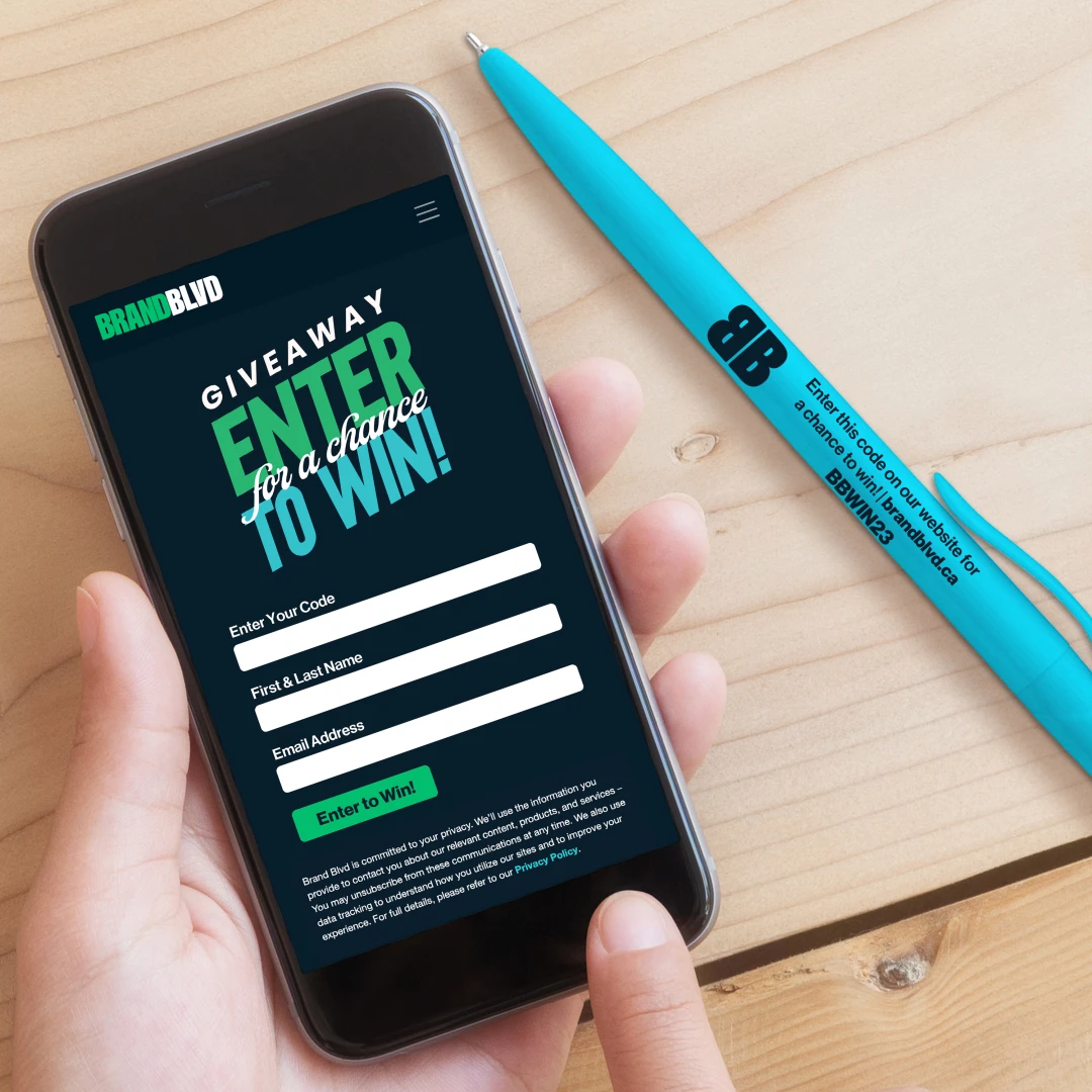 A branded pen featuring unique contest codes to be entered online for a chance to win a giveaway. An example of customized brand engagement strategy with variable data branded merch and swag from Brand Blvd.
