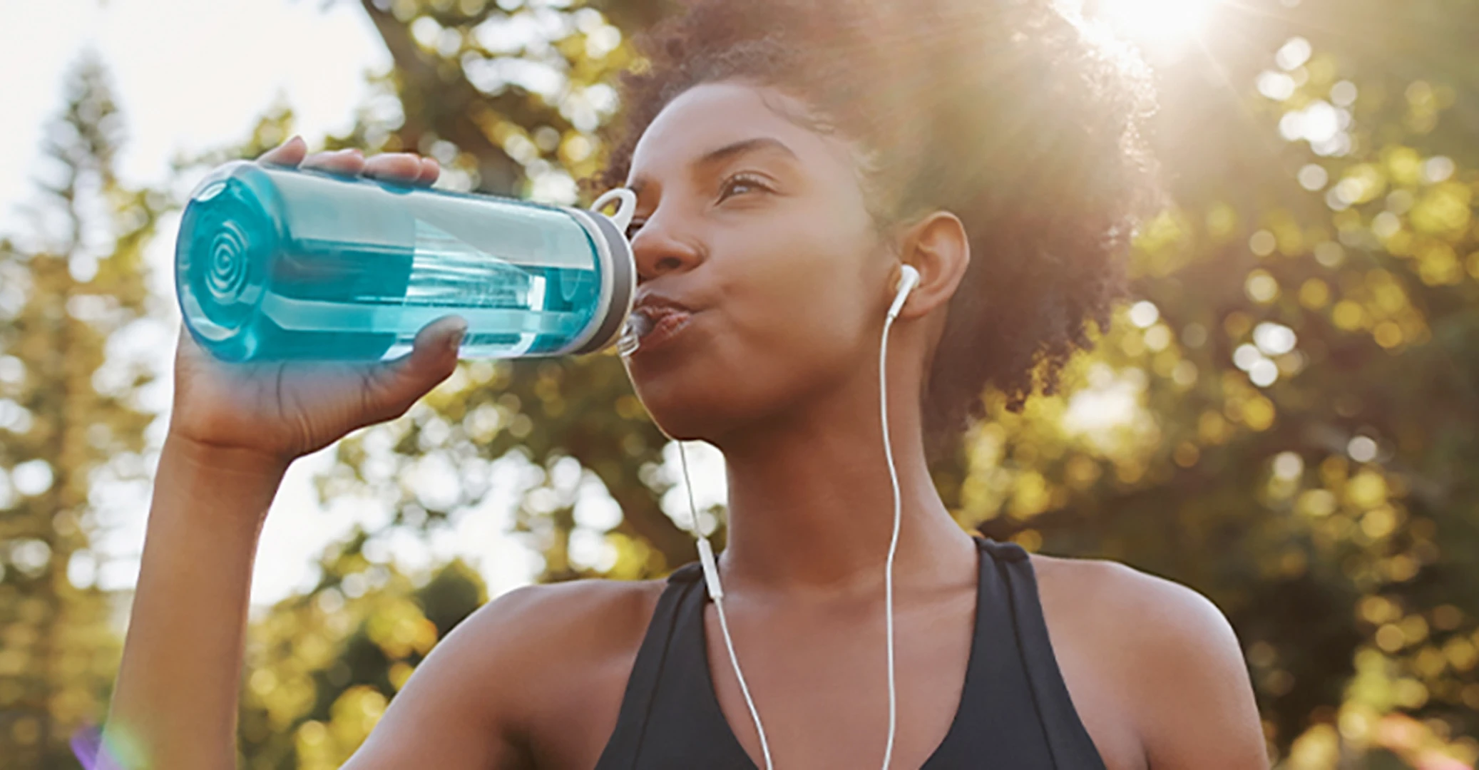 An employee sips from a popular drinkware piece which she brings on every run.