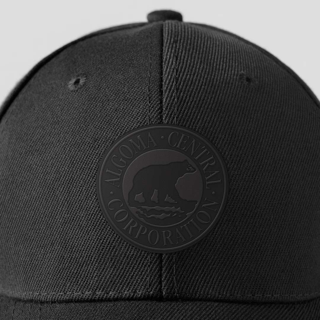 Enhance your branded merchandise and company gifts with a subtle and sophisticated touch, like this black hat featuring the Algoma Central logo embroidered tone-on-tone in black thread for timeless style.