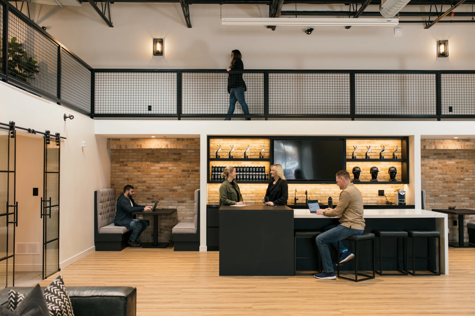 A photo of the main bar and mezzanine level in the Brand Blvd great room.