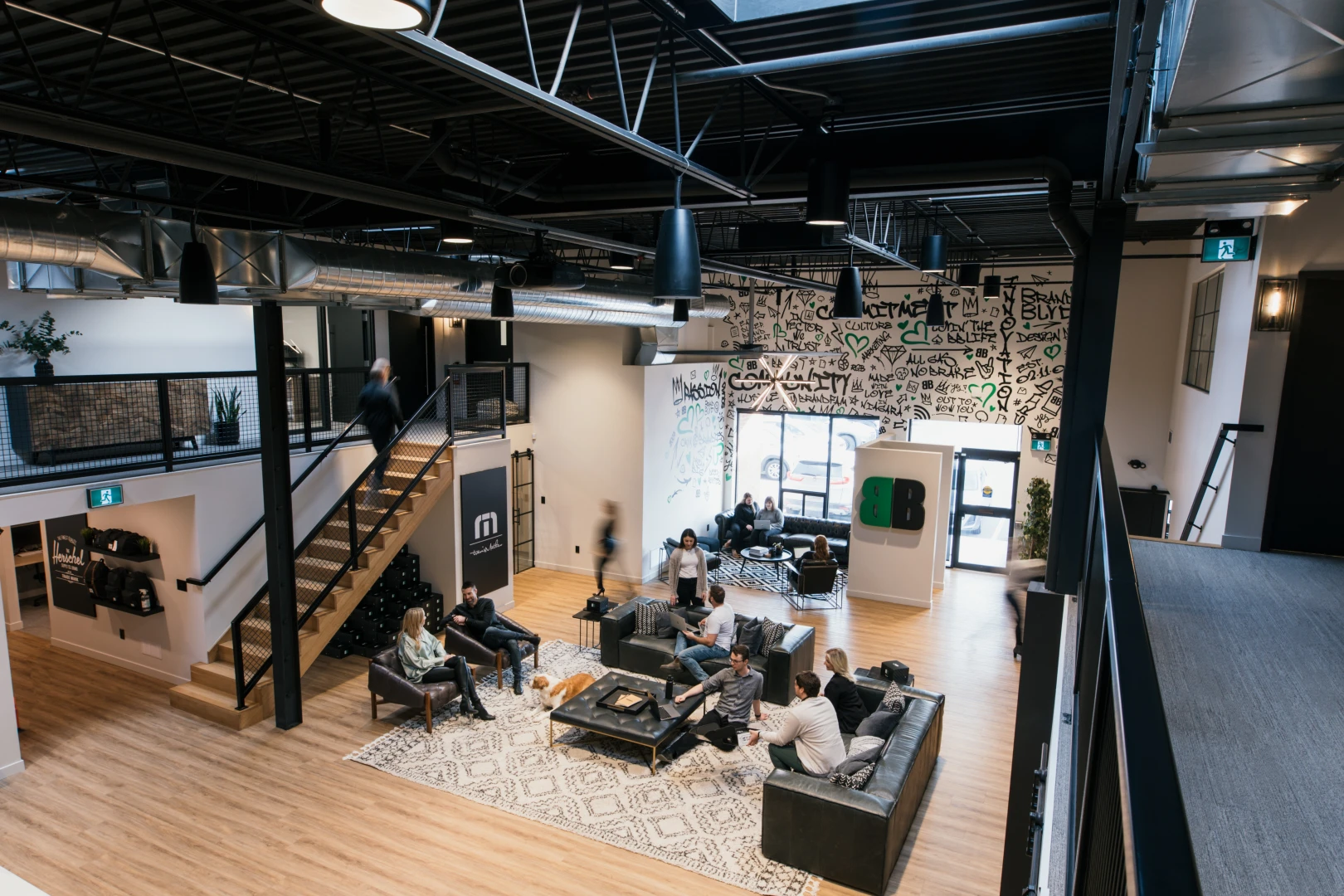 A photo of the Brand Blvd great room with various people in it.