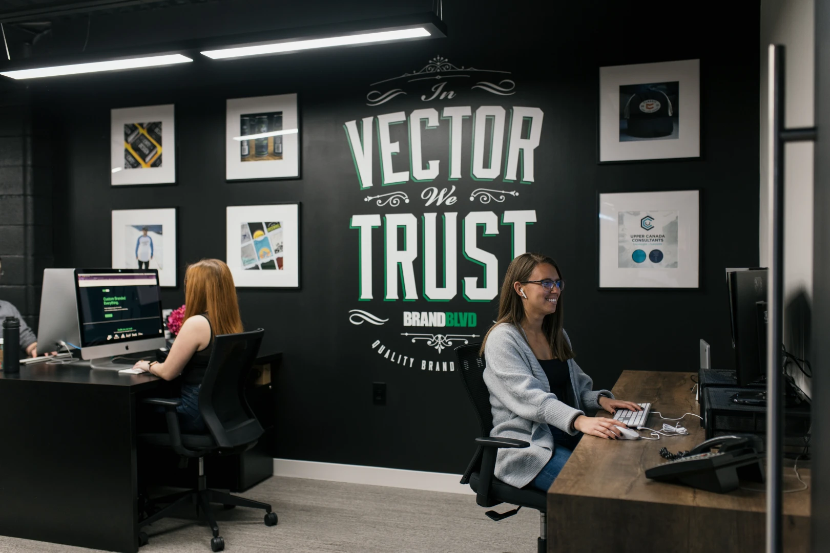 A photo of two people working in the Brand Blvd marketing department