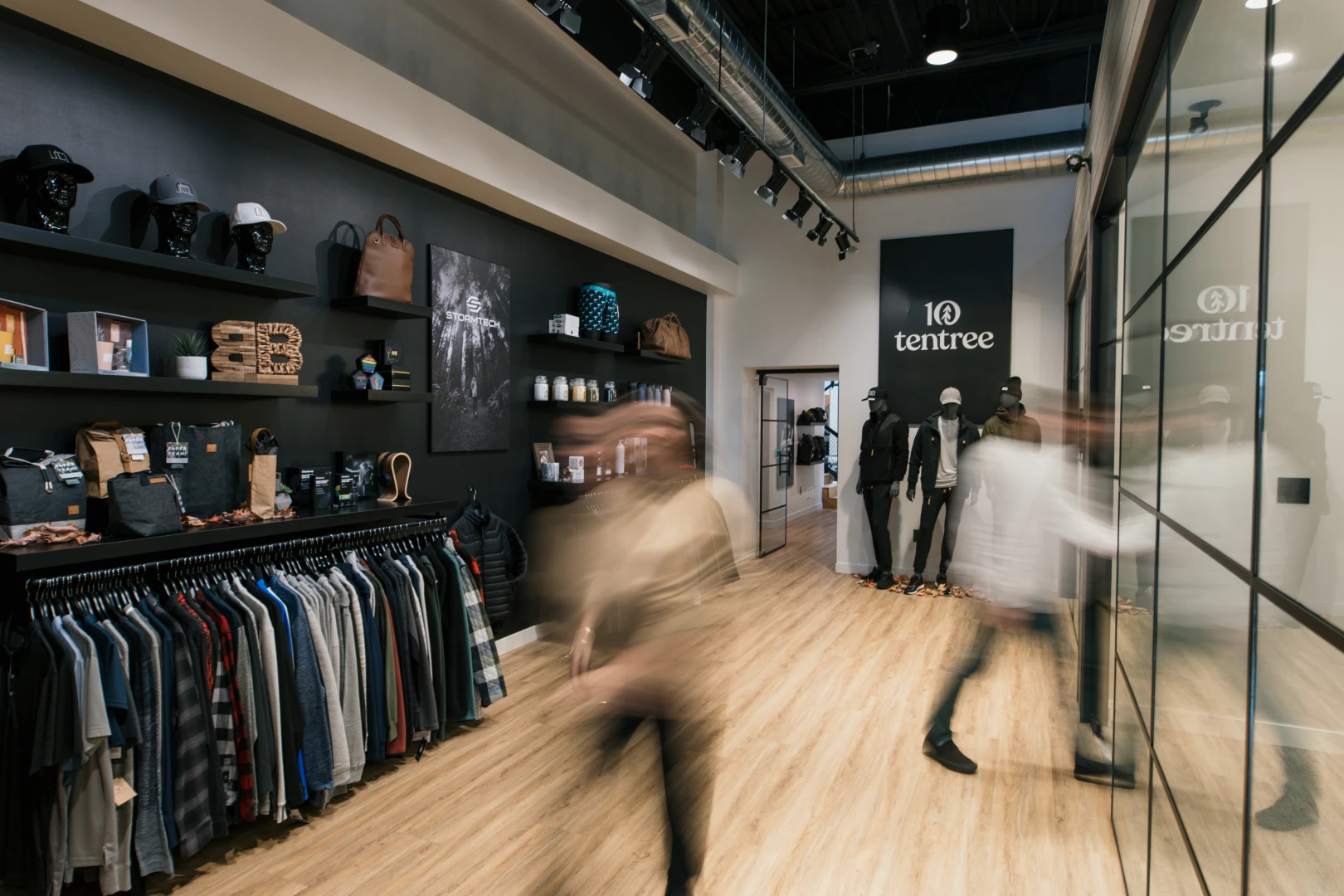 A photo of the Brand Blvd showroom and a few people in motion.