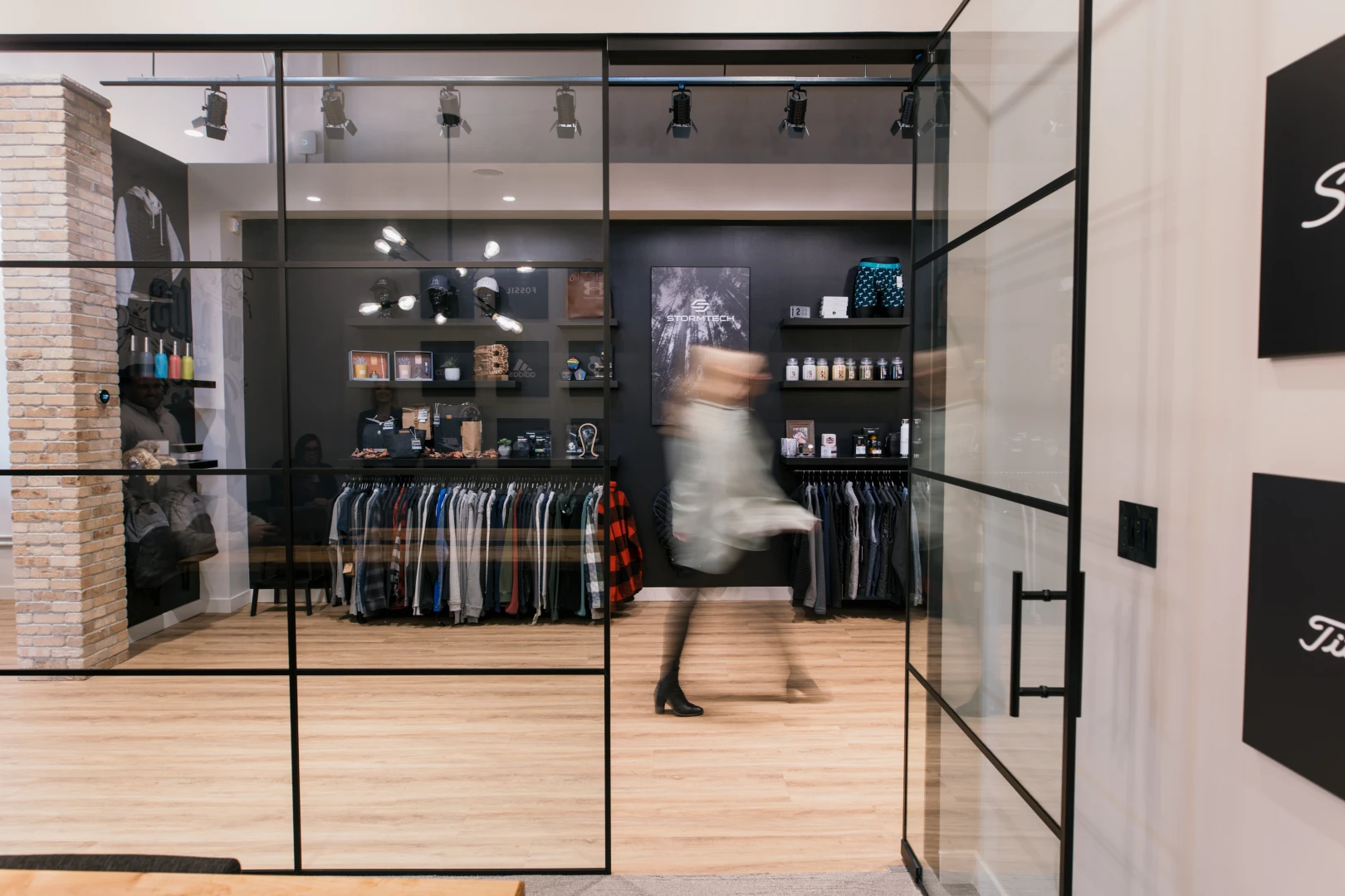 A photo of a person walking by the Brand Blvd showroom.