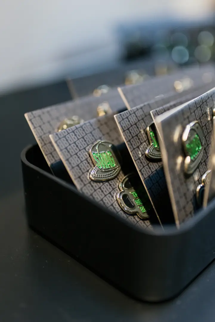 A photo of various Brand Blvd pins.