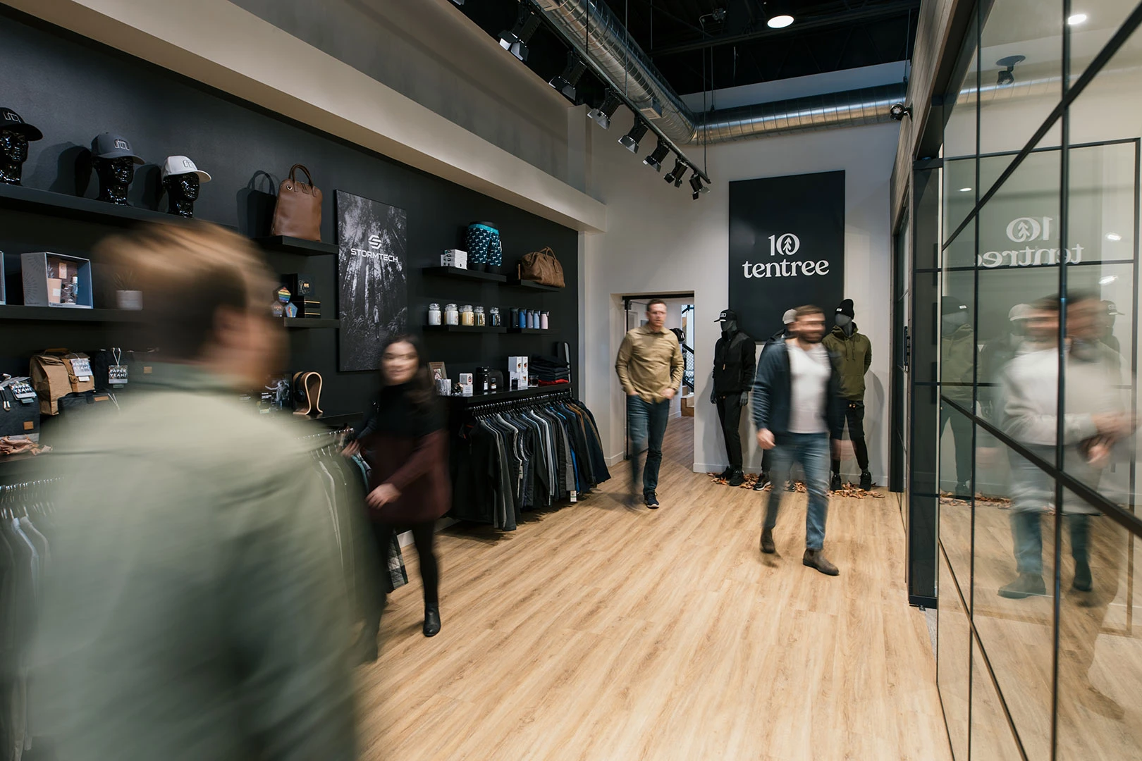 A photo of people walking to and from meetings in the Brand Blvd showroom.