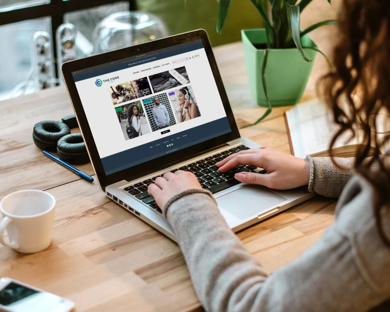 A photo of a person browsing an online store on a laptop.